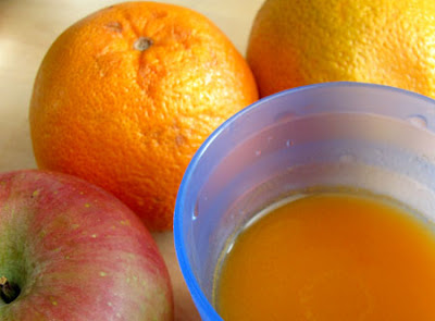 Apple, oranges, cup of juice