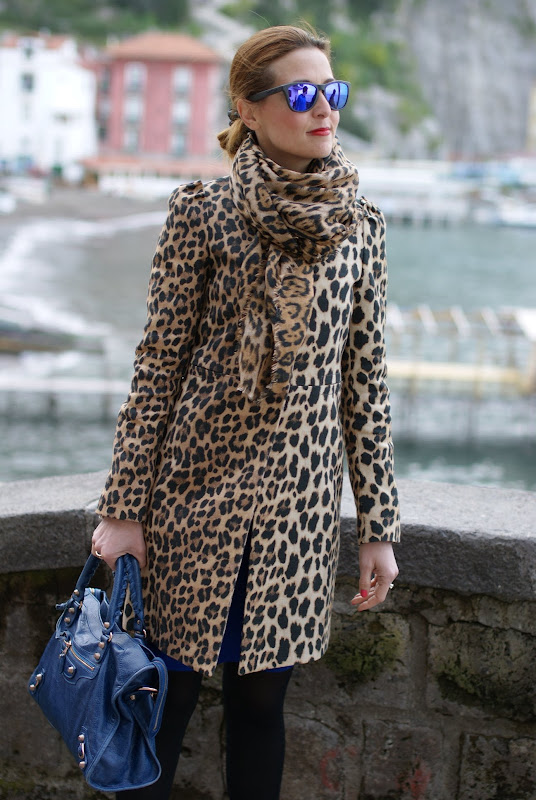 leopard print coat, Balenciaga city bag, Oakley mirrored sunglasses