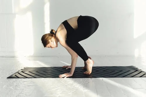 Girl doing crow pose