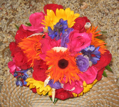 This bouquet is made up of hot pink roses yellow gerbera 