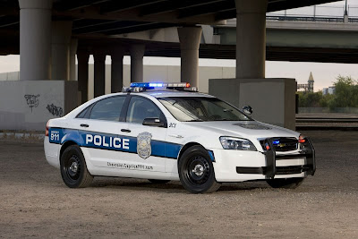 GM equipped Chevrolet Caprise under police car