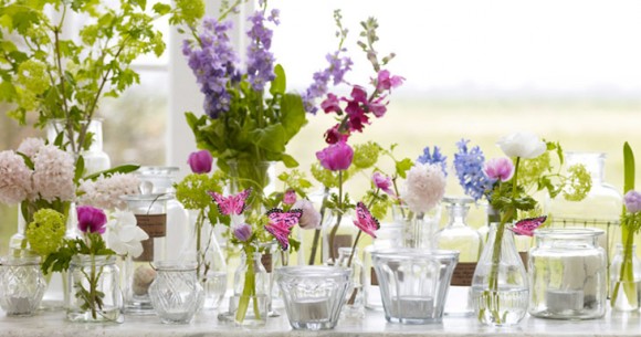 I love the combination of soft pastel colored flowers and vintage bottles