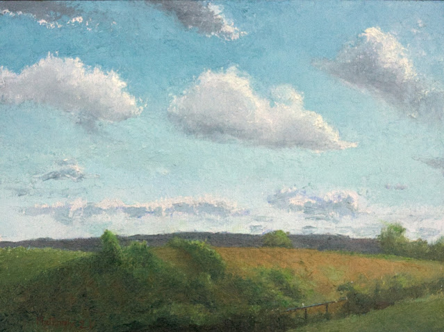 Oil painting of landfill forming a smooth, rounded hill with grass and bushes growing on it, beneath blue sky with fluffy clouds. Chain link fence in foreground.