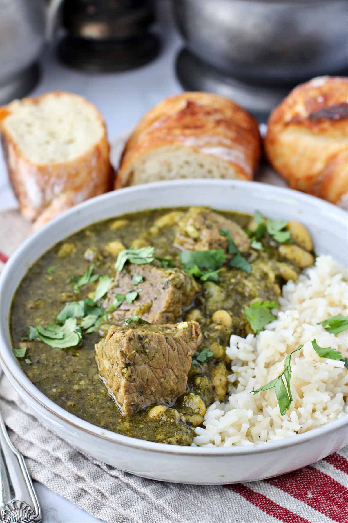 Libyan Lamb Stew with White Beans and Spinach (Lubia bel-Saeilk) in a bowl.