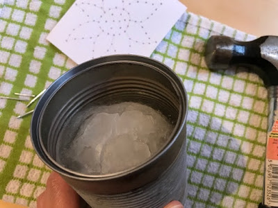 Freezing ice to make tin can lantern