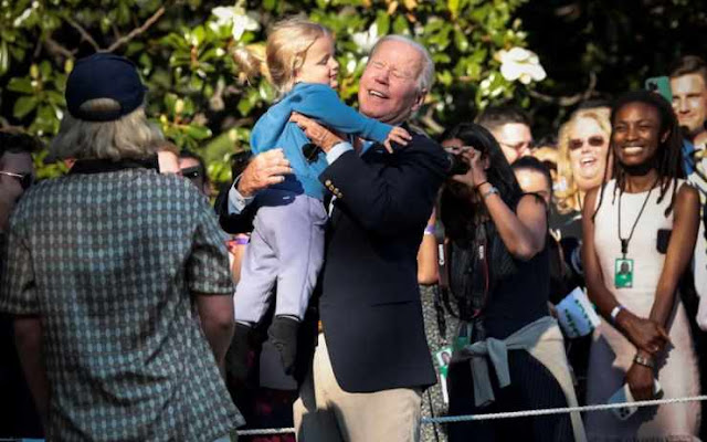 US President Joe Biden lifts his grandson Beau Biden, the son of Hunter Biden, as he arrives on the South Lawn of the White House in Washington, DC, USA, 30 June 2022. EPA, Oliver Contreras, POOL