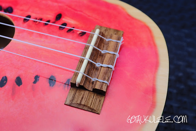 Kala Novely Watermelon Soprano Ukulele bridge