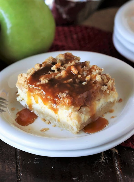 A Caramel Apple Cheesecake Bar served on a white plate. 