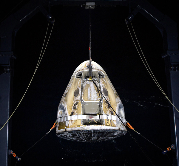 With the Crew-1 astronauts waiting patiently onboard, Resilience is about to be placed onto the deck of SpaceX's GO Navigator recovery ship in the Gulf of Mexico...on May 2, 2011.