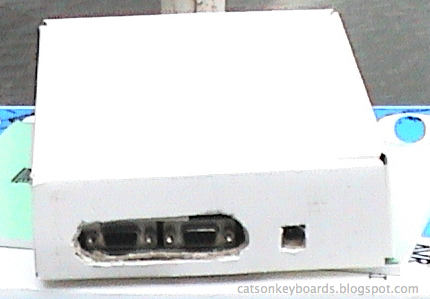 The connector cutouts at the end of the old cardboard box.