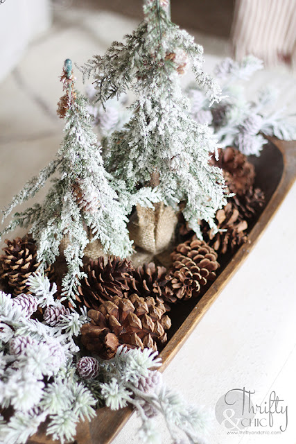 Christmas living room decor and decorating ideas. Christmas decor ideas for dough bowls. Farmhouse Christmas decor. Flocked Christmas trees. Shiplap wall and Christmas. Antique styled wood mantel. Wood mantel Christmas decor.