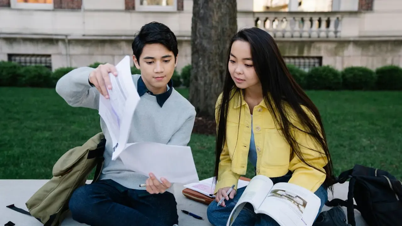 Students studying together with books and notebooks