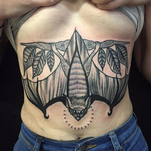 10 Bold Stomach and Sternum Bat Tattoos