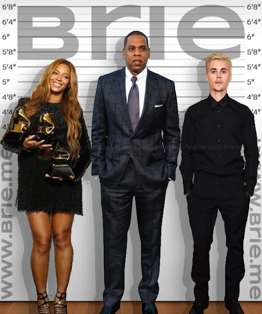 Jay-Z standing with Beyonce and Justin Bieber