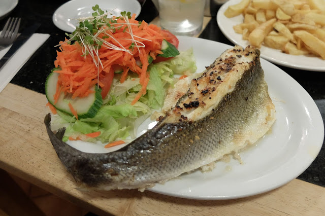 seabass on a plate with salad