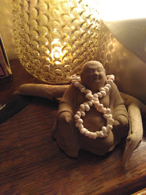 Clay statue of fat happy jolly relaxed buddha