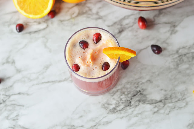 glass of punch on a marble background.