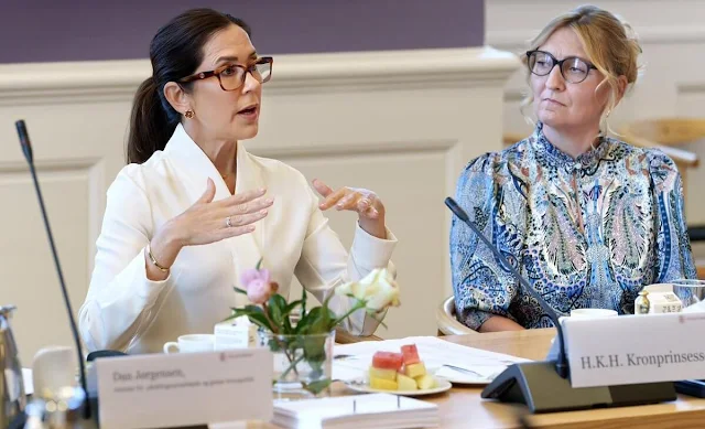 Crown Princess Mary wore a new Bowery ivory stretch silk blouse by The Fold London. Polo Ralph Lauren mid-rise straight-leg trousers