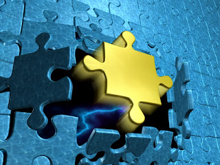 Picture of a puzzle with a golden piece