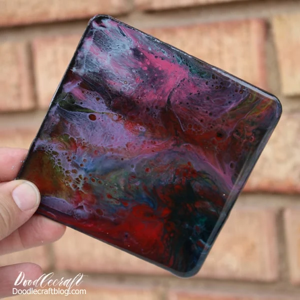 Make stunning galaxy coasters with high gloss resin and vivid colors. These amazing coasters are addicting to make with this fun resin pour technique.