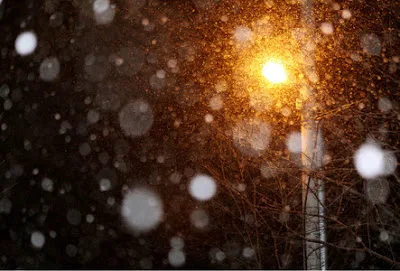 The Snowy Night Under A Streetlamp...