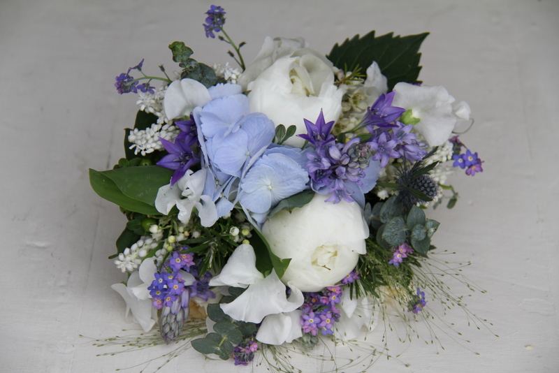 A beautiful Blue Wedding Bouquet of Pale Blue Hydrangeas Sea Holly White