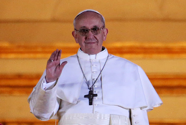  Pope Francis I appears on the central balcony of St Peter's