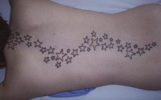 star tattoo on side of body. side of ody. star tattoos