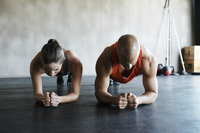 Men and Women Exercising