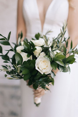 greenery bridal bouquet with white roses and satin wrap