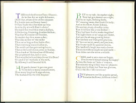 An open book of printed verse, accented with colored initials.