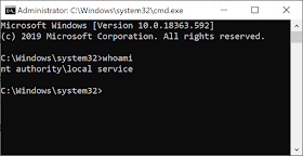 A command prompt, running whois and showing the use as Local Service.