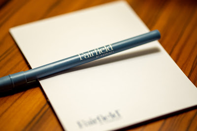 Macro photo of pen and paper on wood table Fairfield Inn by Marriott Santa Cruz California