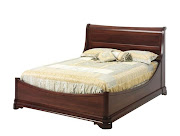 . an elegant Louis Phillipe Sleigh bed or a solid wood desk.