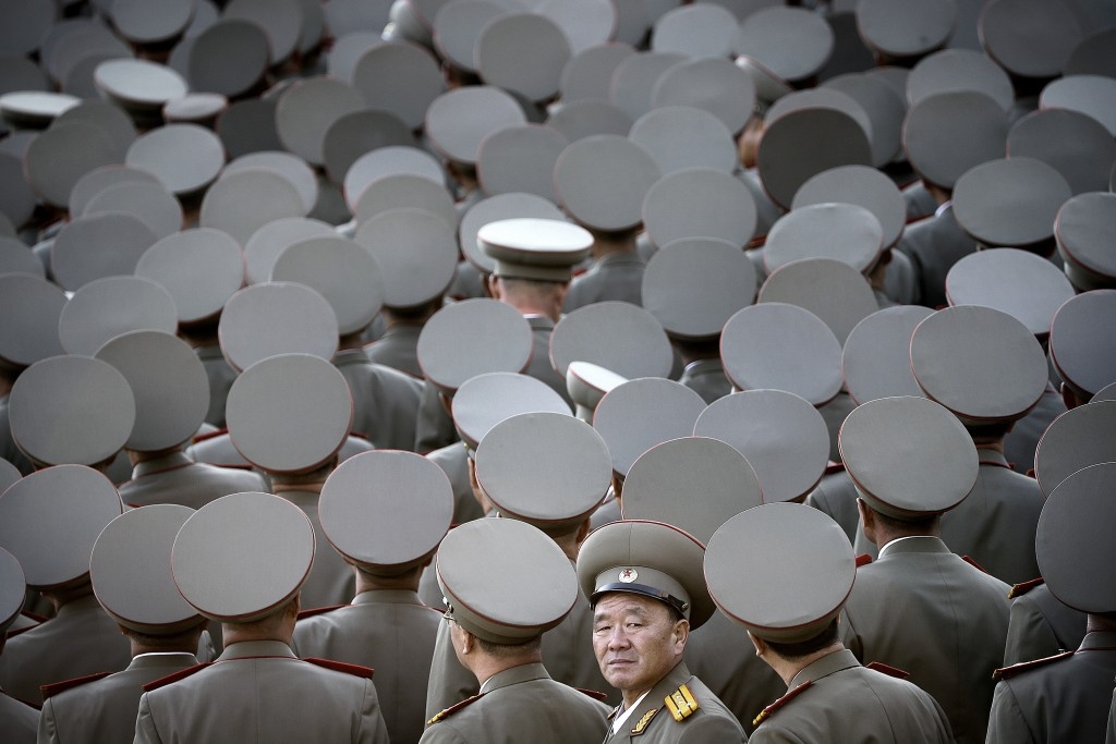 70 Of The Most Touching Photos Taken In 2015 - Veterans turn toward their North Korean leader Kim Jong Un as he delivers a speech during a military parade in Pyongyang, North Korea.