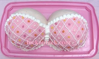 Covered pink color breasts partly covered with bra