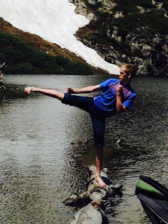 Karate kid doing a sick kick near a lake