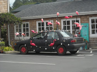 Black Art Car with Flamingos on poles