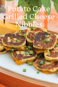 Food Lust People Love: These easy appetizers are perfect for cocktail time and plenty filling for your tapas party. Made with extra sharp cheddar and herby mashed potatoes, potato cake grilled cheese nibbles go down a treat.