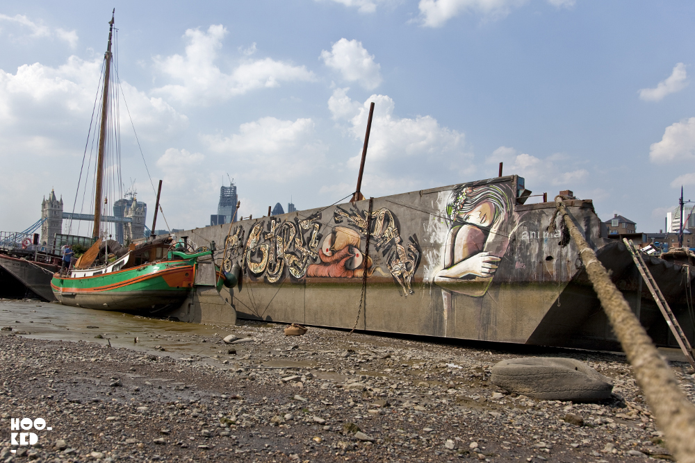 London Street art on a boat at Tower Bridge in London