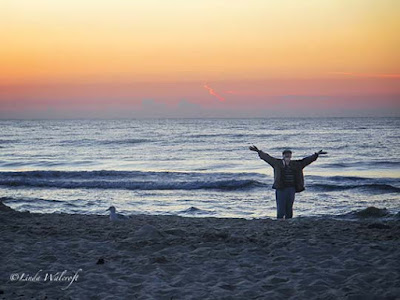 Man at dawn on beach