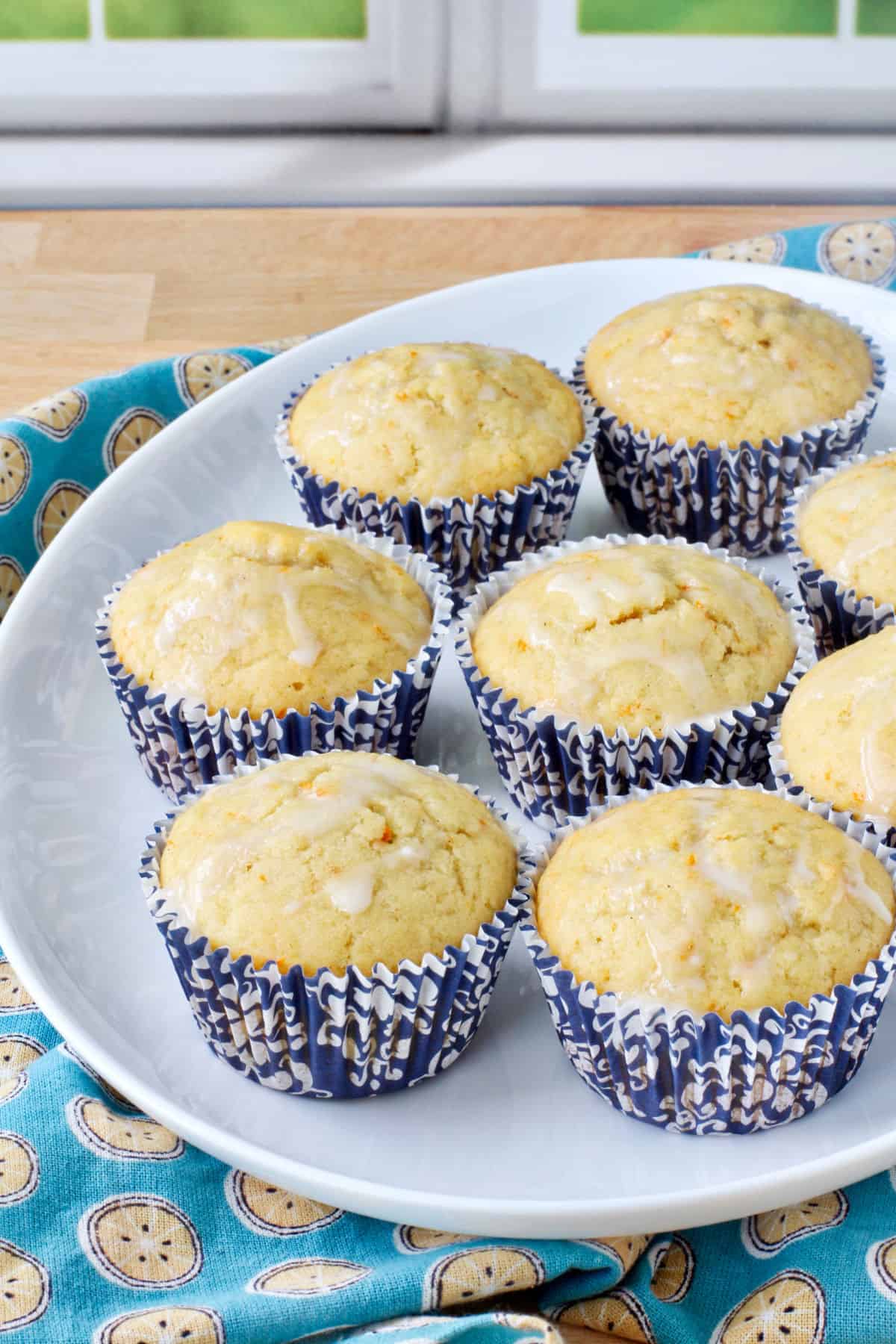 Sourdough Tangerine Muffins on a white platter.