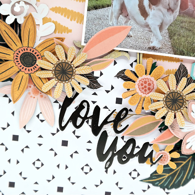 Love you foam sticker title with fussy cut flowers on a scrapbook layout.