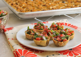 Food Lust People Love: These tiny taco bites are made with oven baked tortillas filled with spicy ground beef and extra sharp cheddar, then topped with a fresh pico de gallo made with onions, tomatoes and jalapeños. They’d be great as an appetizer for your next cocktail party, especially if you are serving margaritas. For the taco seasoning, I use a brand called Tone’s. It comes in a large container so I just scoop out how much I need when seasoning taco and enchilada beef and even fajitas, rather than buying those little pouches of spice mix. Such a waste of packaging. You can always make your own, of course. Plenty of recipes online. For the tortillas, I love the ones at my local grocery store here in Houston, called mitad y mitad: half and half, by which they mean half corn and half flour. This is Texas, after all, where many aspire to be bilingual. They are flavorful because of the corn and supple because of the flour. Use whichever fresh tortillas you can find or your personal favorite.