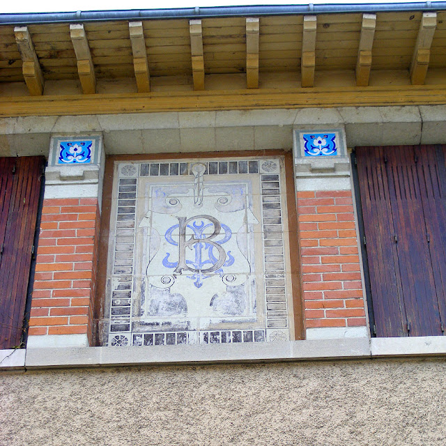 Monogram on the side of Villa Caroline, Les Ormes, Vienne, France. Photo by Loire Valley Time Travel.