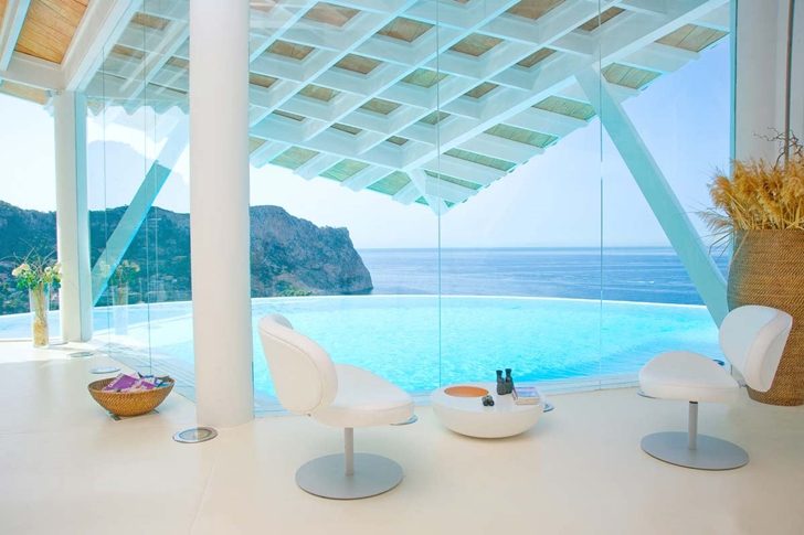 Glass walls of Mediterranean villa in Mallorca by Alberto Rubio
