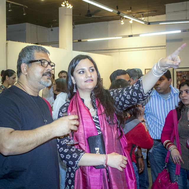 'FAITHfully Yours', a Photography Exhibition is inaugurated on 8th March at Arpana Caur Gallery near Siri Fort Auditorium. Inauguration was at 7pm and event lasted for 3-4 hours. Seven Artists Ambik Sethi, Augustus Mithal, Rajesh Ramakrishnan, Raajan Sharma, Shilpi Choudhuri, Shivani Punia and VJ Sharma are showcasing their work during next 10 days. Show will be on till17th March 2013.Show was inaugurated by the famous Fashion Designer Rina Dhaka, Award Winner Journalist Sonal Kalra, the famous Indian Contemporary Artist Jaishree Barman and few other ladies. Since it was a women's day, all ladies were there as chief guests. It was great to have Paresh Maity at inauguration. Mr. Paresh Maity has had more than 50 shows in thirty years. He gradually moved from atmospheric scenery to representations of the human form. His more recent paintings are bold and graphic, with a strong color and unusual cropping. His works are in a number of collections, including the British Museum, and the National Gallery of Modern Art, New Delhi. In early years he did many watercolors of different locations.Paresh painted for newly built Terminal 3 at Delhi Airport. He has created the biggest painting of his life and probably the longest in India. It stretches up to over 850 feet and is surely one of the most monumental paintings in the world. In August 2011, his 55th solo show with water colour paintings based on the last 15 poems of poet Rabindranath Tagore, Shesh Lekha (The Last Writings, 1941), opened at the National Gallery of Modern Art, New Delhi. Many known faces from Photography, Art and media were around.  Every photographer has described FAITH in different aspects of life. Some have worked on some aspects of religious faith around the world, Faith in relationships and many more other aspects very well shown through visuals. VJ shares his work around 'The Question of FAITH' - Faith exists everywhere and in all of us, and yet everyone questions faith. The concept of faith is ridden with dilemmas, contradictions, and uncertainties. Human beings have searched for answers to these for centuries. Many philosophers have come to various conclusions, but the questions resurface without fail. These questions will continue to haunt us till we find the answers we are ready to accept. This photographic journey is an attempt to confront some of these questions and to reflect upon the world of the faithful, as we know itShilpi talking about her work and sharing with Rina Dhaka. Her work mainly revolves around various phases of life an how FAITH changes from one stage of life to another. She is showing great set of visuals in 9 frames. Overall response on inauguration day was amazing and whole group of artists if excited about next week.PHOTO JOURNEY will keep sharing more about this exhibition which is on for next whole week in Delhi