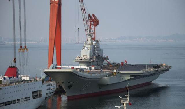 This photo shows the Chinese aircraft carrier Liaoning docked at the seaport city of Dalian in northeast China's Liaoning province, July 6, 2014.
