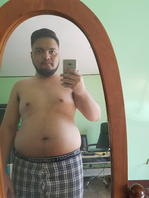 Fat Filipino Holding Samsung Phone For Mirror Selfie