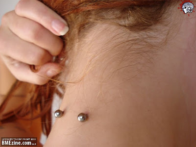 neck surface piercing. and this one (wasnt sure if i should post the pic, 